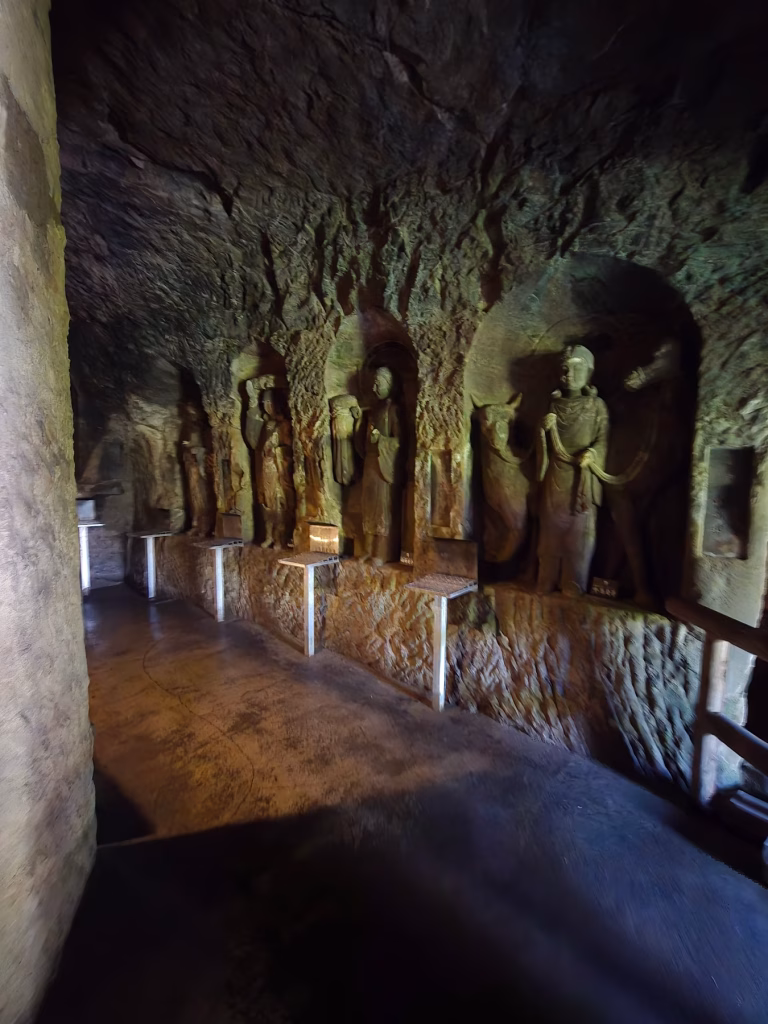 Narrow stone passage inside the Benten-kutsu Caves at Hasedera Temple in Kamakura
