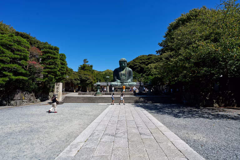 Visitors gathered around the Kamakura Great Buddha