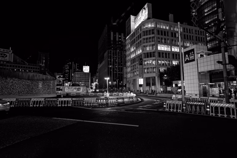 Shinjuku street glowing with neon signs at night