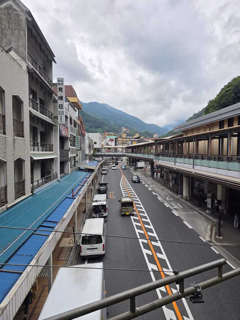 Quiet street in Hakone near the train station with small shops and overcast skies