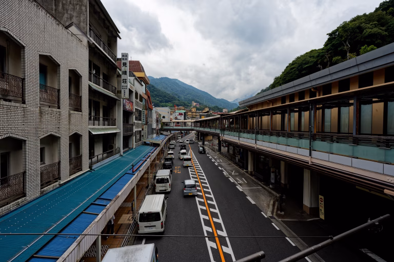 Quiet street in Hakone near the train station with small shops and overcast skies