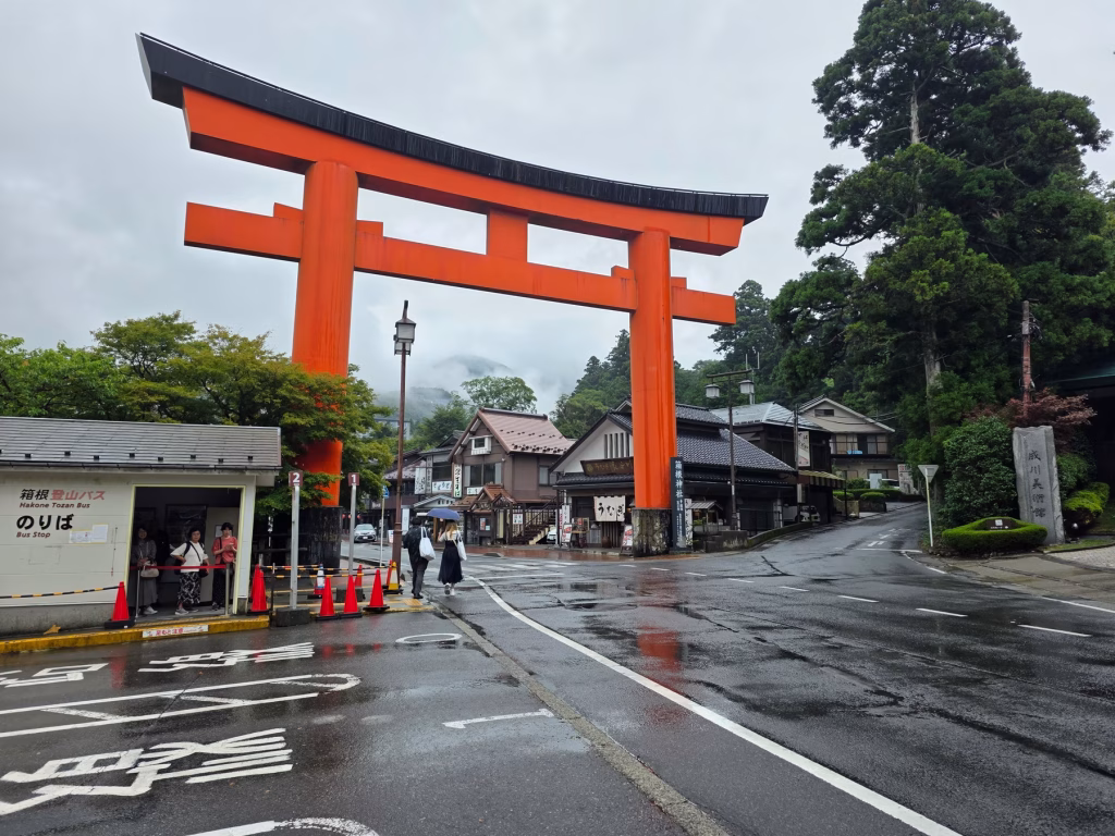 Tori gate overlooking damp Hakone streets with overcast skies